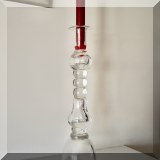 D27. Pair of tall glass candlesticks. 